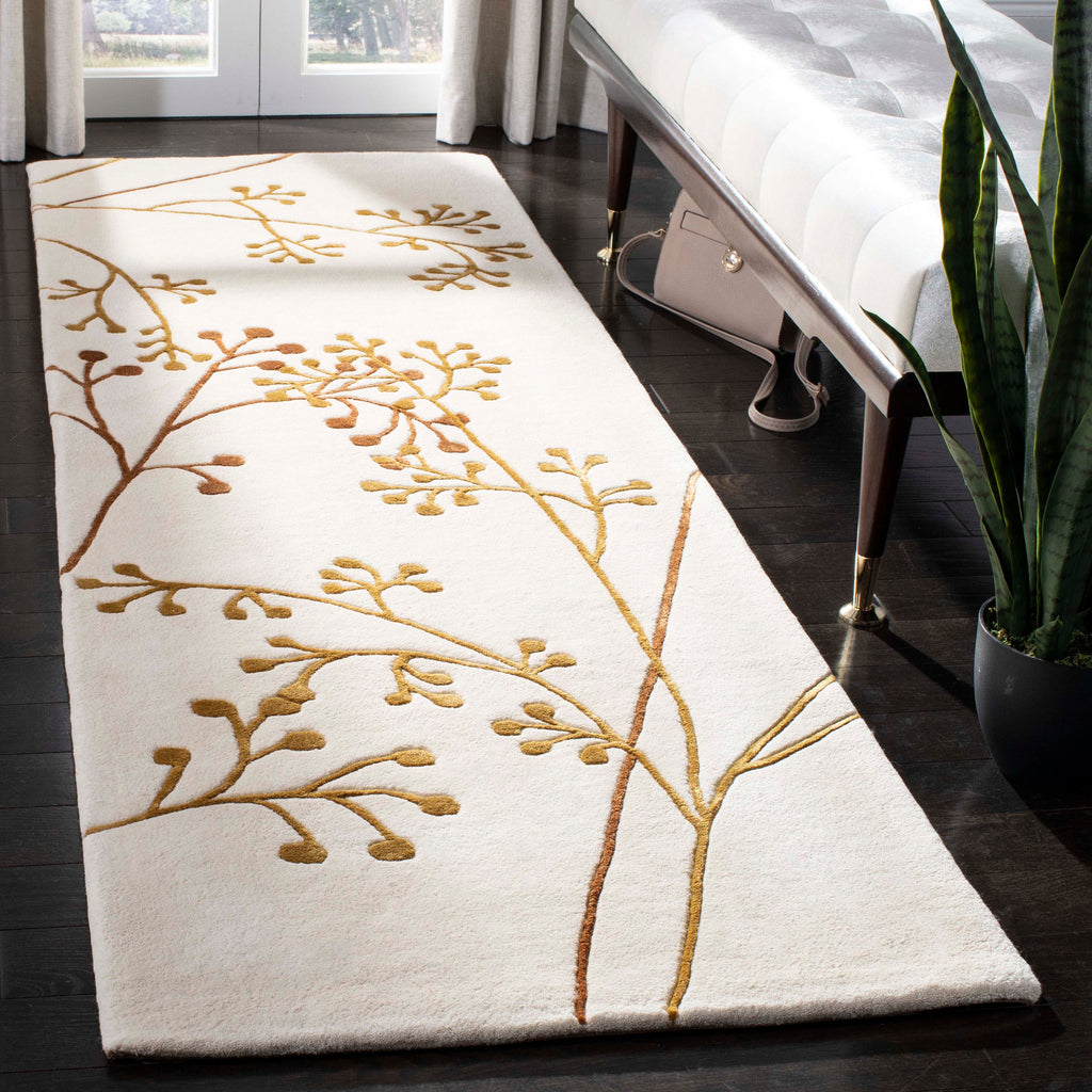 Safavieh Soho Rug Collection: SOH305B - Ivory / Orange