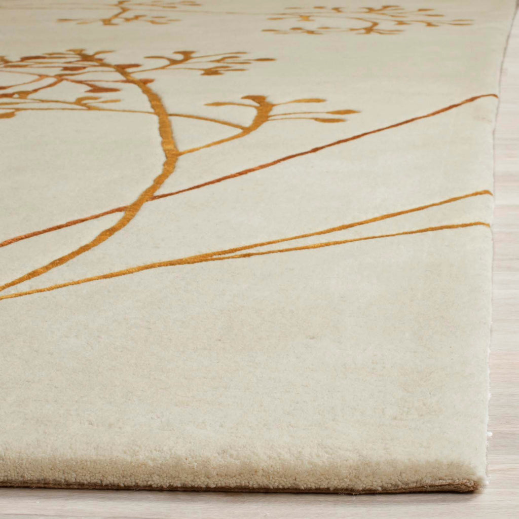 Safavieh Soho Rug Collection: SOH305B - Ivory / Orange